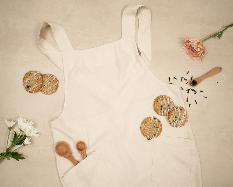 a white apron with some cookies on it