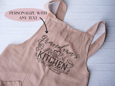 a pink apron with the words personalized on it