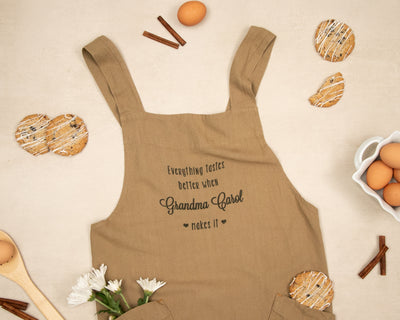 a brown apron with a message on it next to eggs