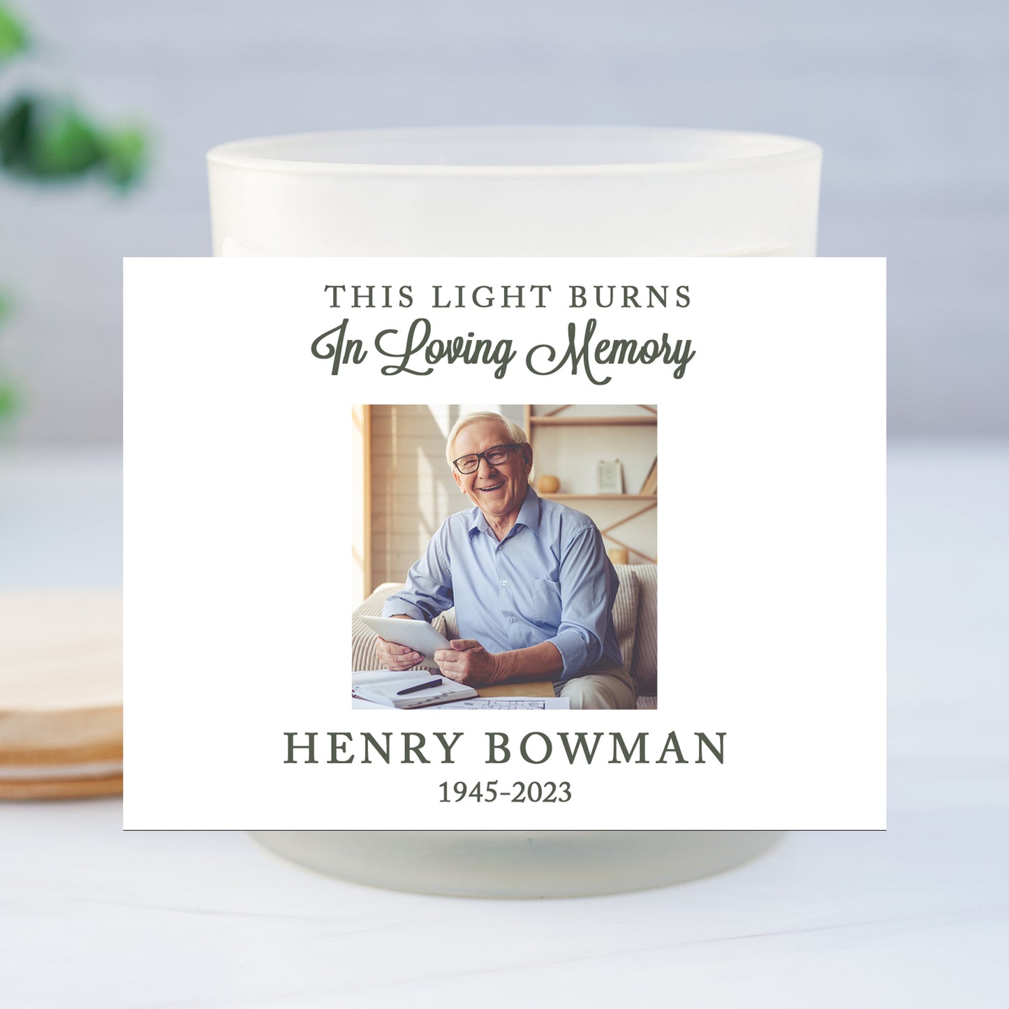 a candle with a picture of a man on it