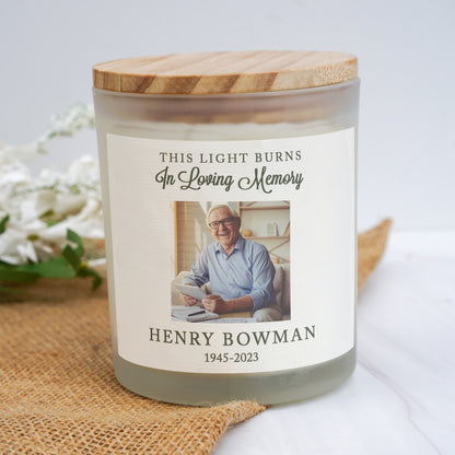 a candle with a picture of a man on it