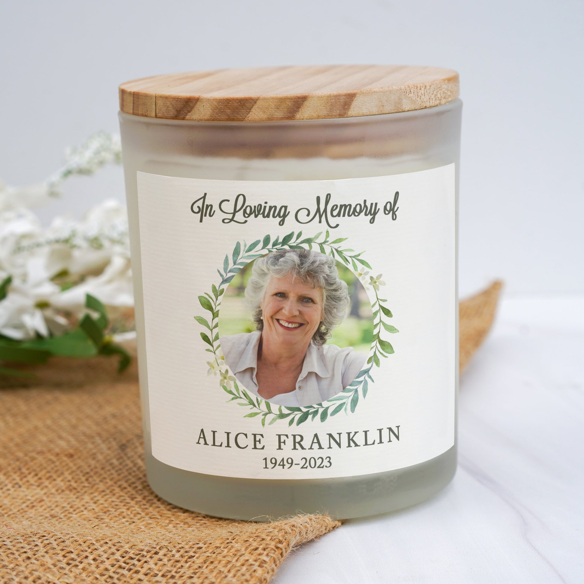 a candle with a picture of a woman on it