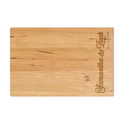 a wooden cutting board with a name on it